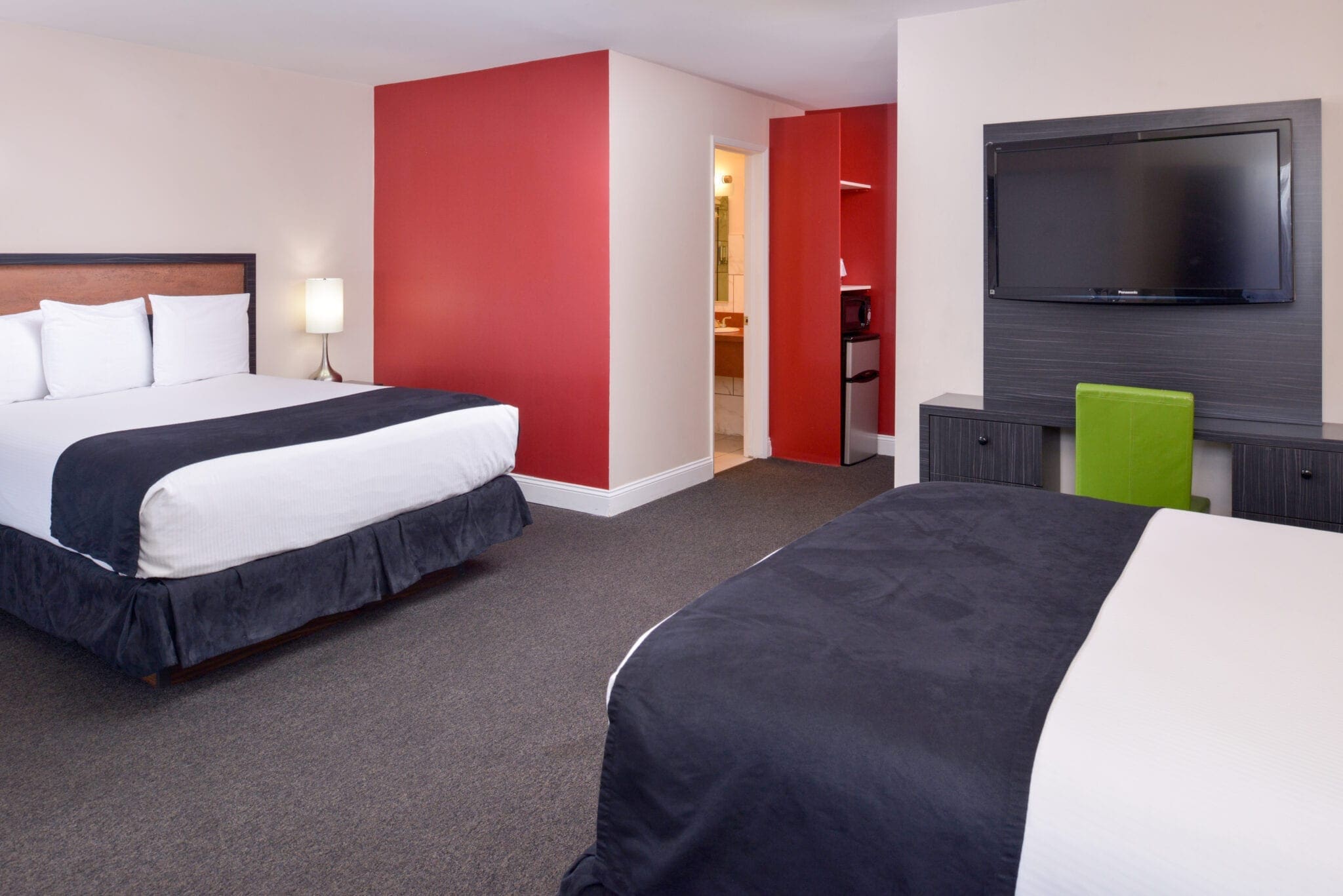 Our Premium Double Queen room features two queen-size beds and will accommodate up to 4 adults.
