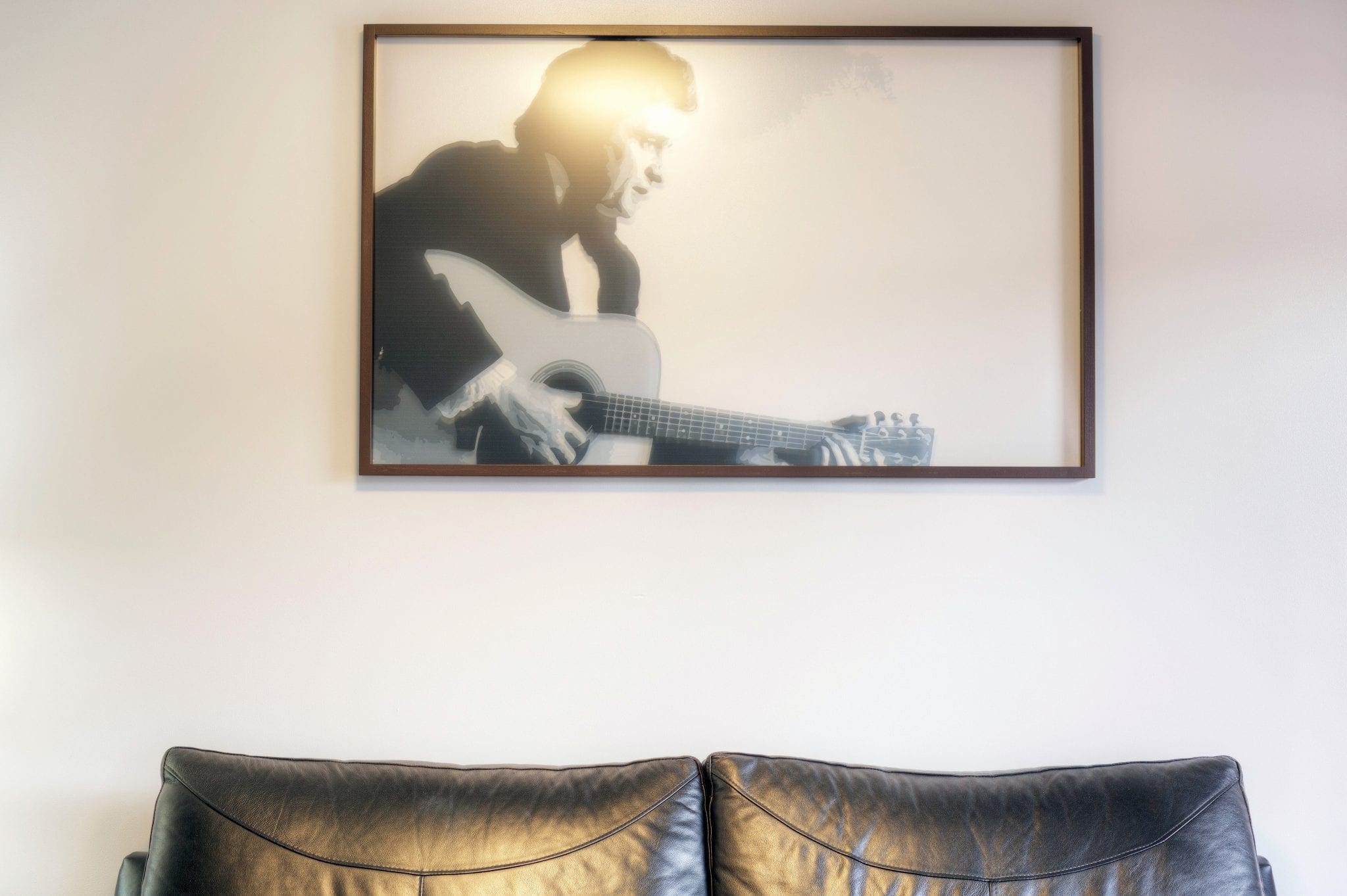 Our Premium King room features unique art including this one of Johnny Cash