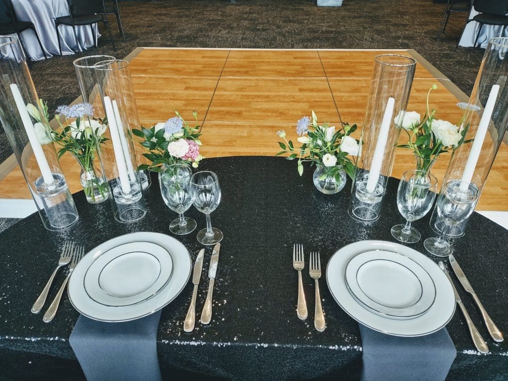An indoor venue space in the Ruby River Hotel. This space has been set up as a Bride & Groom table setting.